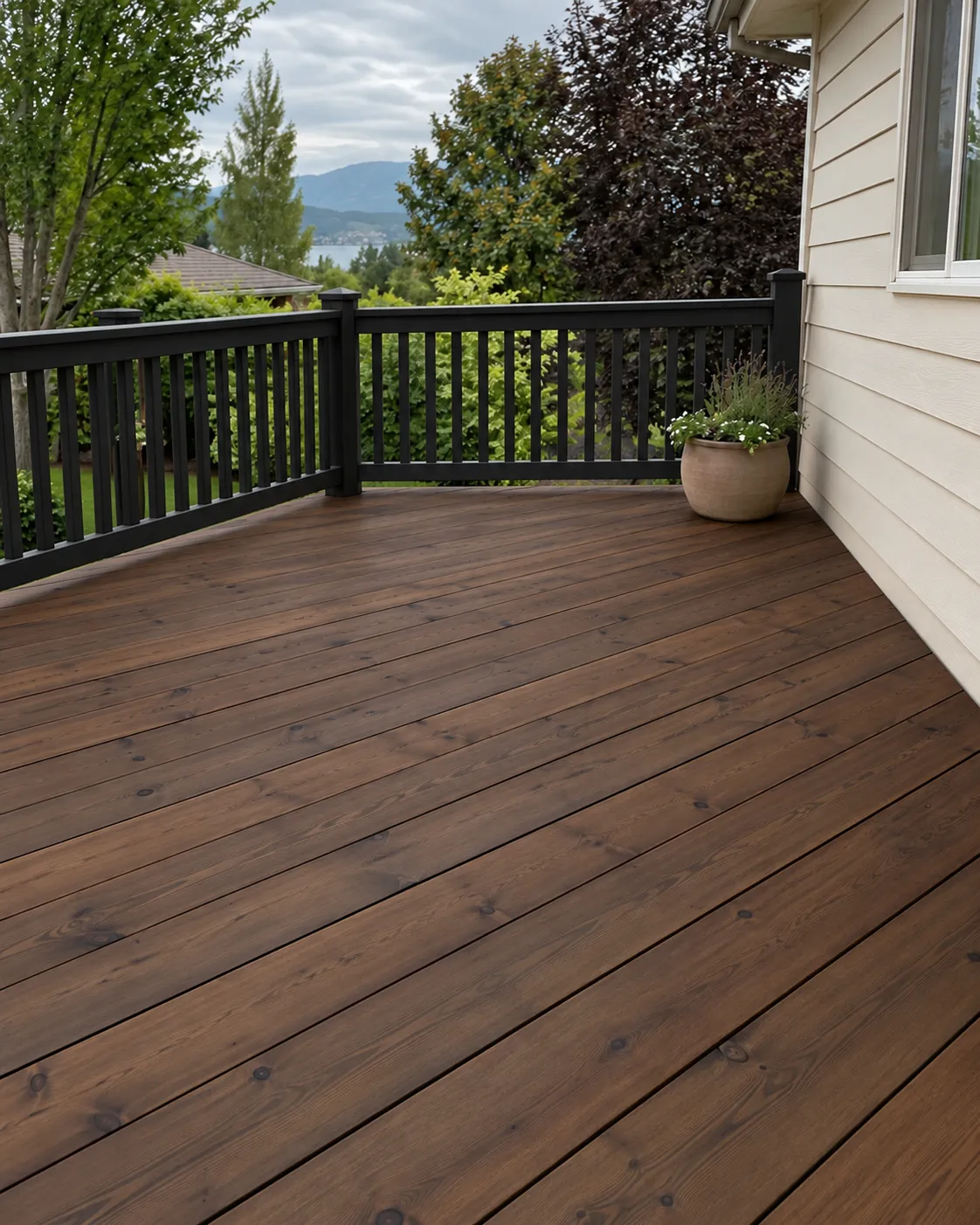 Illustrative walnut deck boards with contrasting black timber railings.